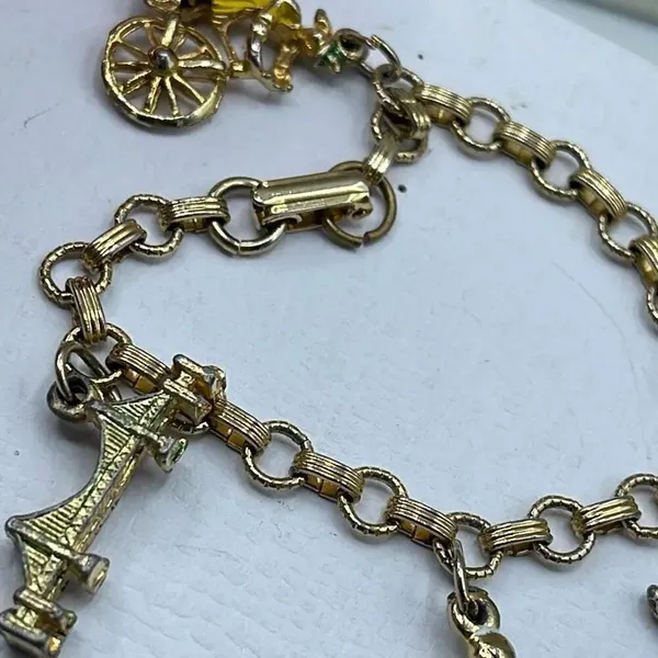 Vintage 6” charm bracelet. Gold tone with crossover clasp. - Image 6