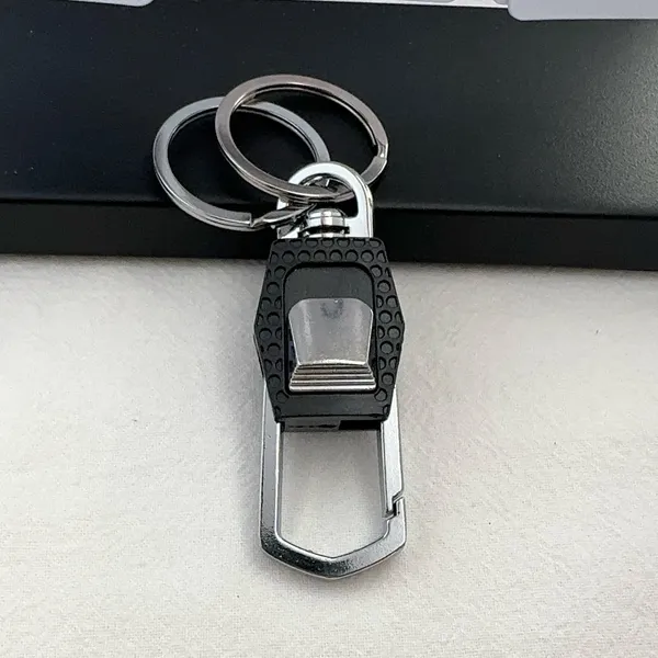 Practical carabiner keychain designed for both men and women for everyday carrying needs. Comes with double key rings, allowing you to classify and organize different keys separately. This keychain is 2.5 inches in length and 0.9 inches in width, compact and portable to carry around. Suitable for car keys, home keys, small gadgets, backpacks and handbags for convenient hanging. Simple versatile style matches various scenarios, a nice daily accessory and casual small gift. - Image 4
