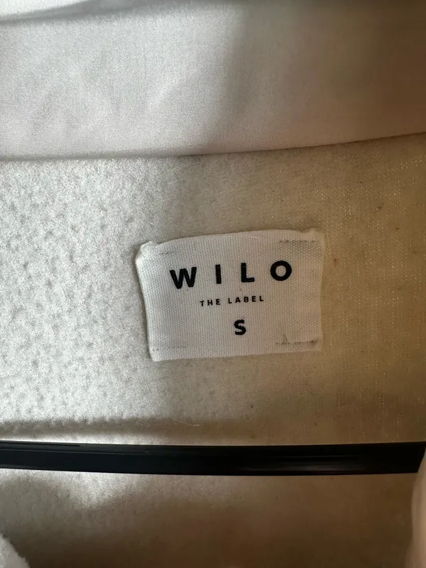 S107. WILO The Label, size Small, an ivory/cream cozy sherpa fleece pullover with snap placket, chest pocket, zip hand pockets, and adjustable hem. - Image 2
