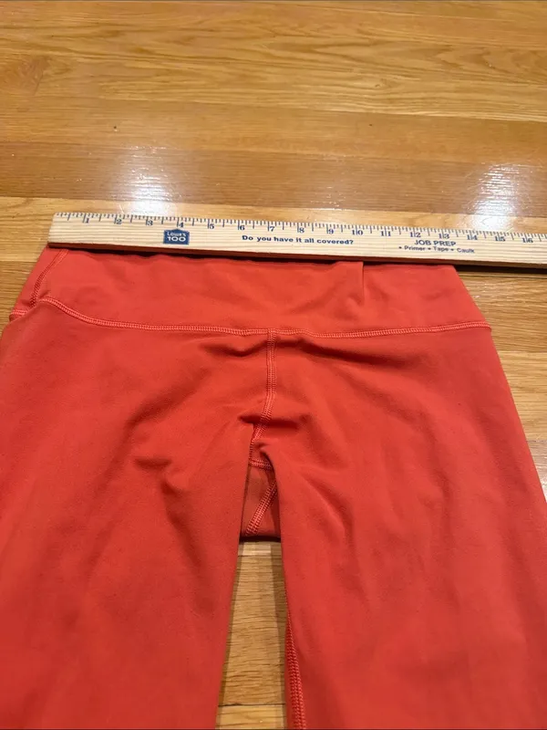 Fleo orange leggings size large . - Image 6