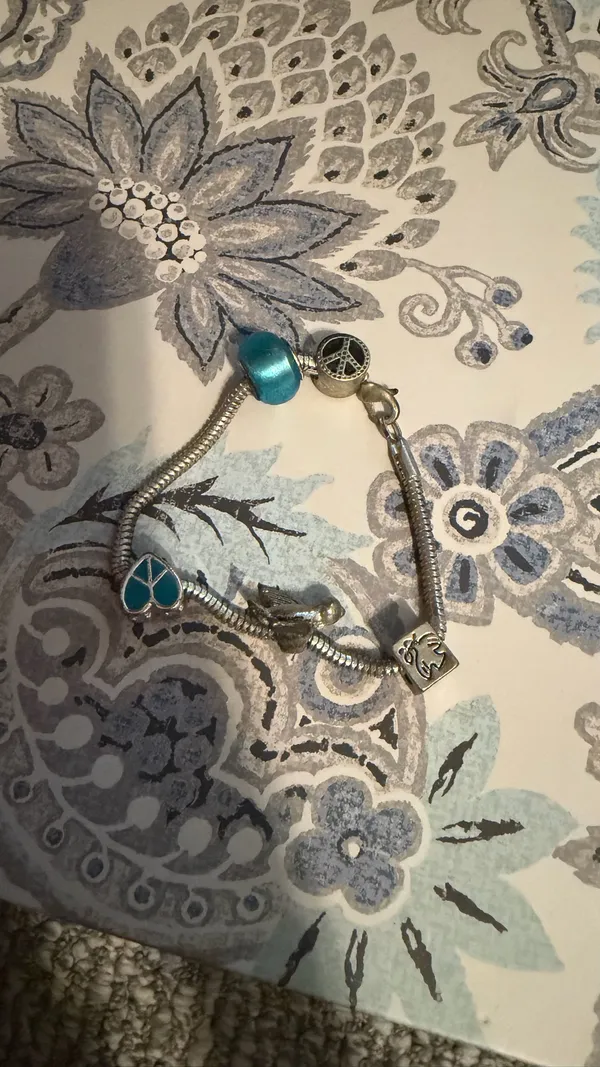 Turquoise Silver Charm Bracelet with Blue Beads birds and peace theme - Image 2
