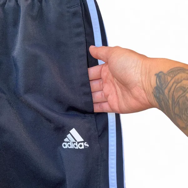 Black Adidas track pants with white stripes - Image 4