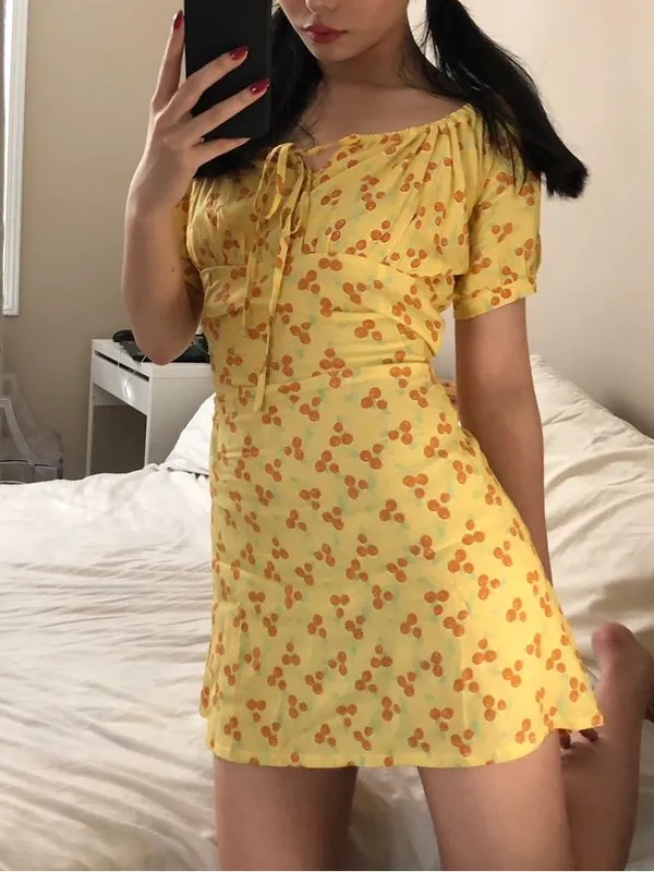 With Jéan Loretta Dress in a yellow multi-color print - Image 4