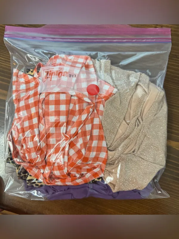 An orange and white gingham crop top with spaghetti straps and a back tie - Image 4