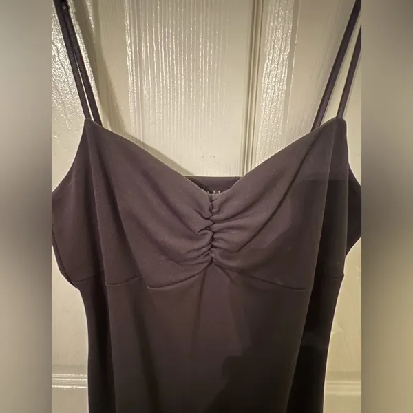 Black dress with ruffles at the bottom. - Image 4