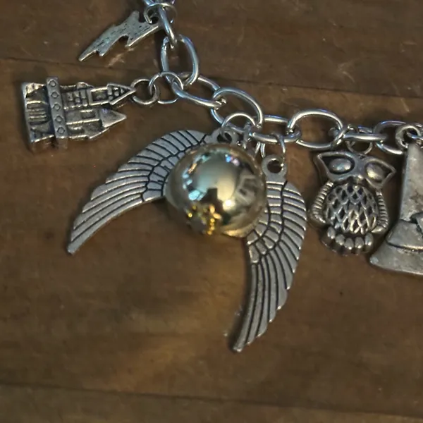 Silver tone charm bracelet with assorted charms - Image 6
