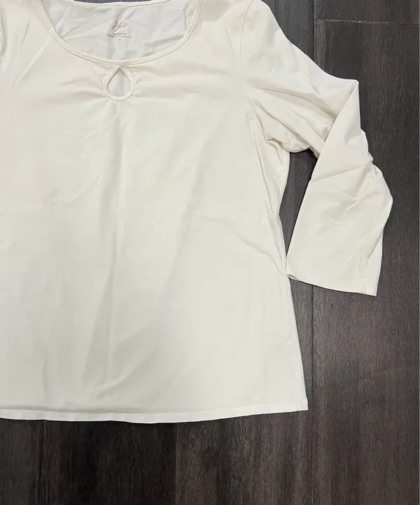 Soft cream long sleeve top with a modest scoop neckline. Features a small decorative ring keyhole at center front. Lightweight, easy to layer for casual or office wear. Simple, clean silhouette for versatile styling. J, Jill size medium. 95% cotton 5% spandex - Image 4