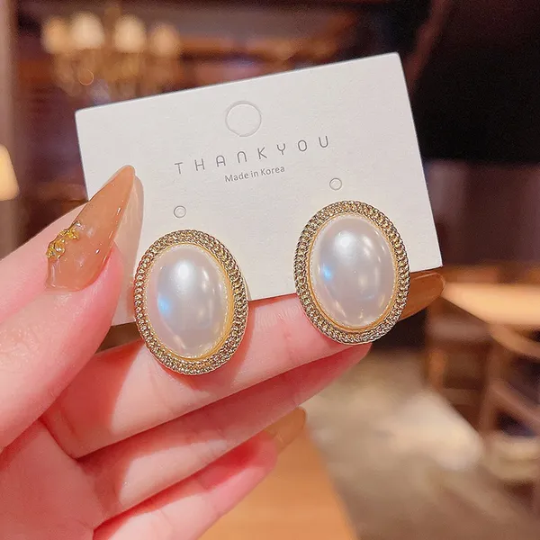 Elegant White Pearl Stud Earrings for Women - Image 3