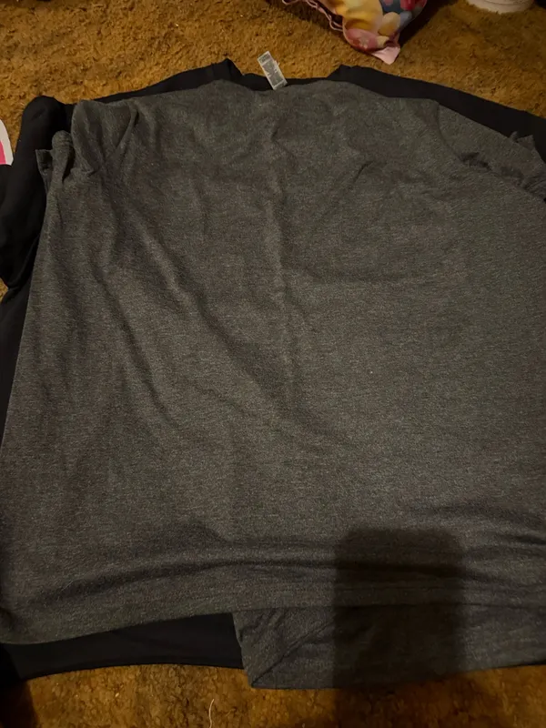 Gray t-shirt featuring a ghost print in teal and pink of the Hitchhiking Ghosts of the Haunted Mansion. Great for Disney parks and Halloween parties. - Image 3