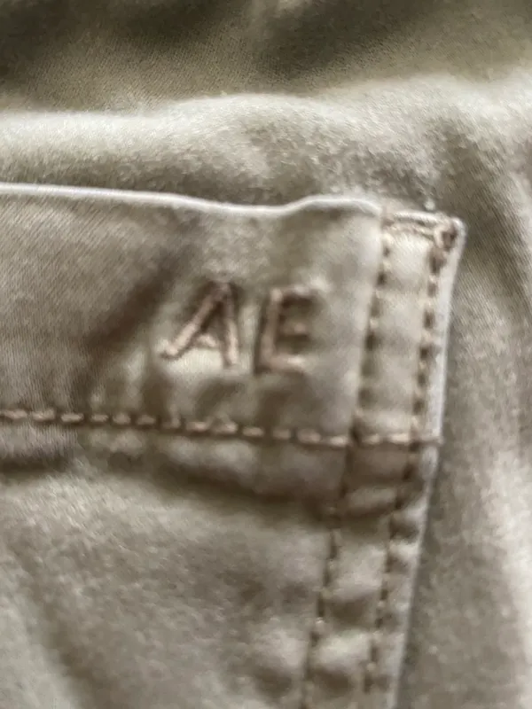 American Eagle -ARMY GREEN JOGGER PANTS-SIZE 2 Elastic waist with drawstring, zip front, two front and two back pockets, elastic ankles with a side zipper, excellent condition Measurements: Waist: side to side 13-16 inches Rise: 9 inches Inseam: 37 inches - Image 14