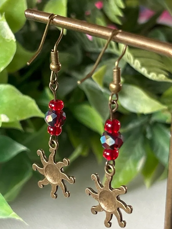 Handmade brass sun earrings with red crystal beads - Image 3