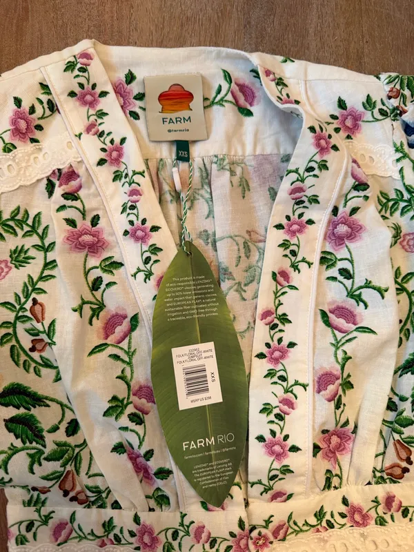 The Farm Rio Folk Floral Jumpsuit features a vibrant print with short sleeves, a V-neckline, and a relaxed, wide-leg silhouette. - Image 4