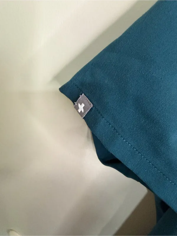 Figs Women’s Teal V-Neck Scrub Top with Navy Pants - Image 6