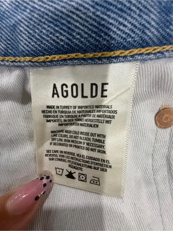 AGOLDE Light Wash Distressed Denim Cutoff Shorts - Image 10