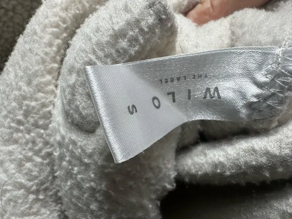 S107. WILO The Label, size Small, an ivory/cream cozy sherpa fleece pullover with snap placket, chest pocket, zip hand pockets, and adjustable hem. - Image 3