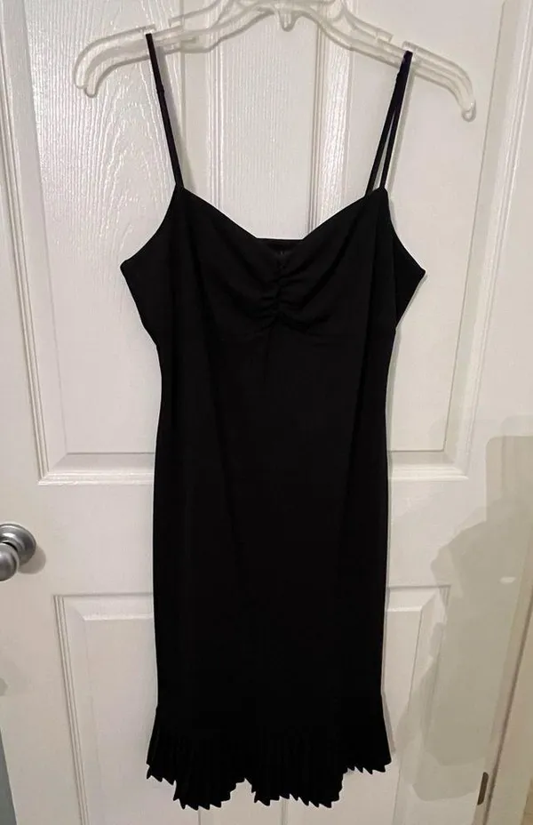 Black dress with ruffles at the bottom. - Image 6