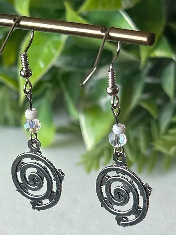 Handmade Silver Star Spiral Drop Earrings with White Bead Accent - Image 4
