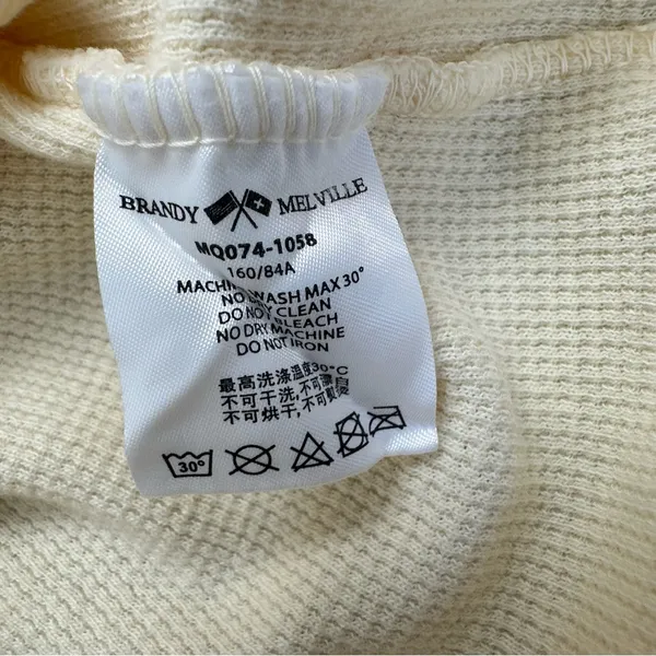 yellow Brandy Melville tee with a cute criss-cross detail - Image 5
