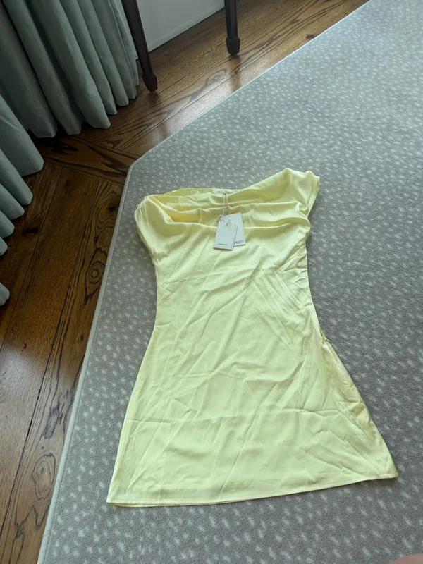 Sleek one-shoulder mini dress with draped neckline. Smooth, fitted silhouette for a modern look. Soft lemon yellow tone for a fresh, feminine vibe. Ideal for evening outings or special events. - Image 2