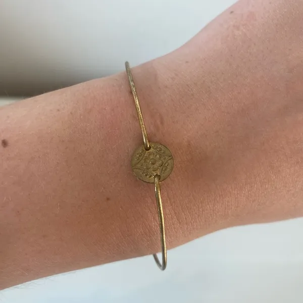 Delicate Gold-Tone Wire Bracelet with Coin Charm - Image 2