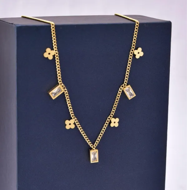 Dainty Clovers & CZ Charms Gold Necklace - Image 4