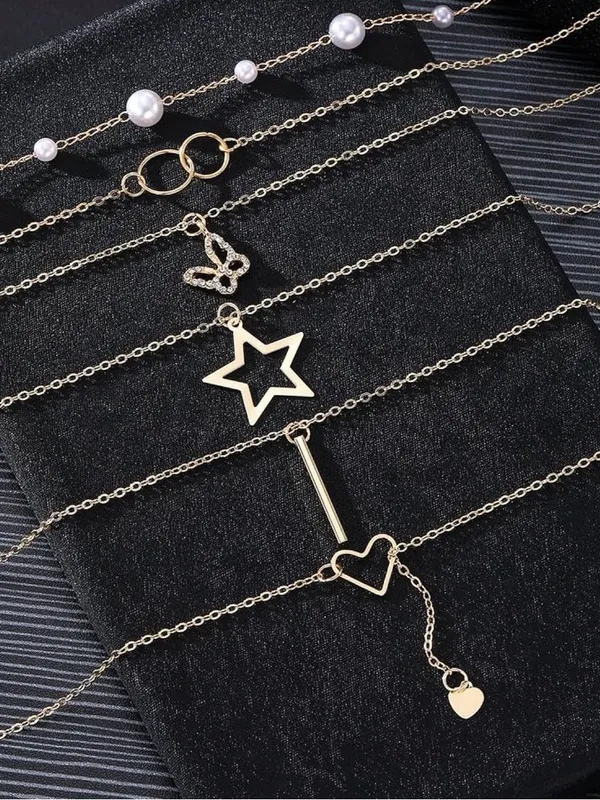 14K Gold Plated Multi-Layered Necklace with Star, Key, and Butterfly Charms - Image 6