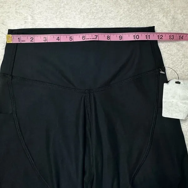UFC Women's Black Bike Shorts with Red Logo and Side Pockets - Image 8