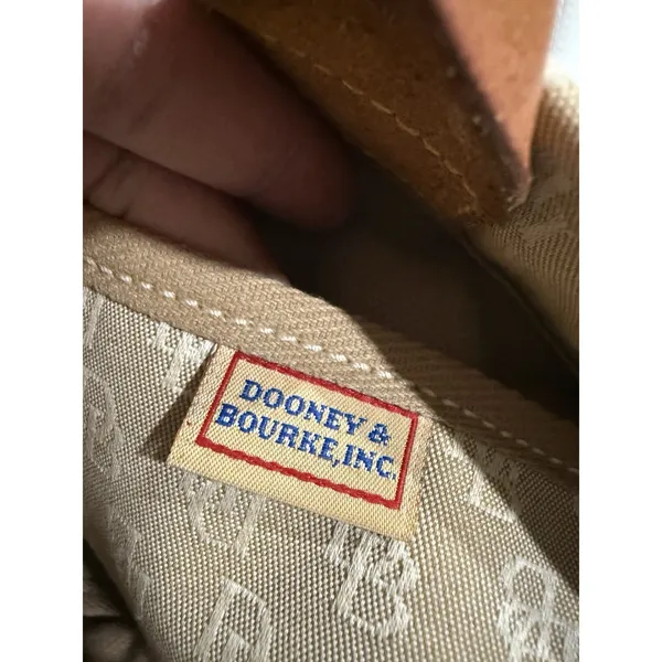 Dooney and Bourke Beige Canvas and Leather Signature Tassel Tote Handbag‎ - Image 6