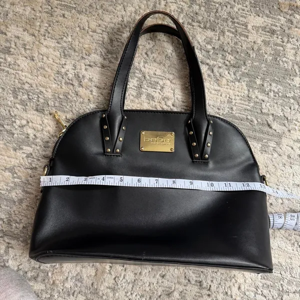 faux leather black Bebe shoulder bag with gold hardware and stud accents - Image 6