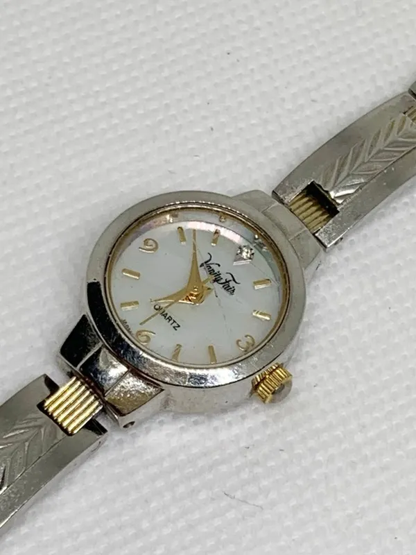Vanity fair women’s watch silver gold tone 20mm mop dial quartz analog running - Image 8