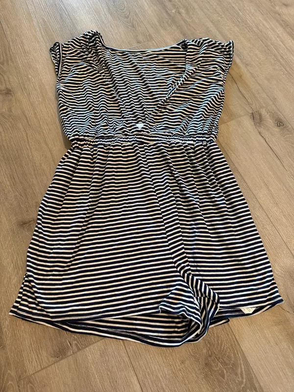 Urban Outfitters Striped Romper - Excellent Condition - Women’s Size M Description: Upgrade your casual wardrobe with this effortless Urban Outfitters striped knit romper! Made in the USA, this stylish piece features a classic navy and white nautical stripe pattern with a flattering deep V-neckline, soft cap sleeves, and a comfortable cinched elastic waistband. Crafted from a soft, lightweight stretch fabric, it’s perfect for summer outings, beach cover-ups, or casual weekend wear. Brand: Urban Outfitters Size: Women’s Medium (M) Condition: Excellent, like-new condition with no visible flaws, stains, or excessive wear. Details: Elasticized waist, short inseam, breathable stretch material, made in USA. Fast shipping from a smoke-free home! Feel free to drop a comment with any questions or send reasonable offers. - Image 2