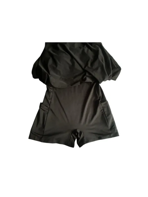Black athletic dress with built-in shorts with side pockets and a sports bra. - Image 3