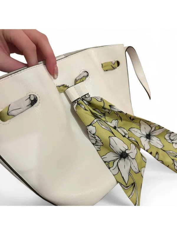 Minimal white bucket bag with removable floral scarf detail - Image 4