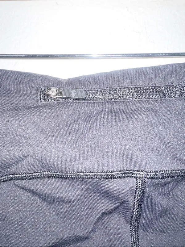Lululemon Women’s Black Active Leggings with Side Pockets and Reflective Details - Image 9