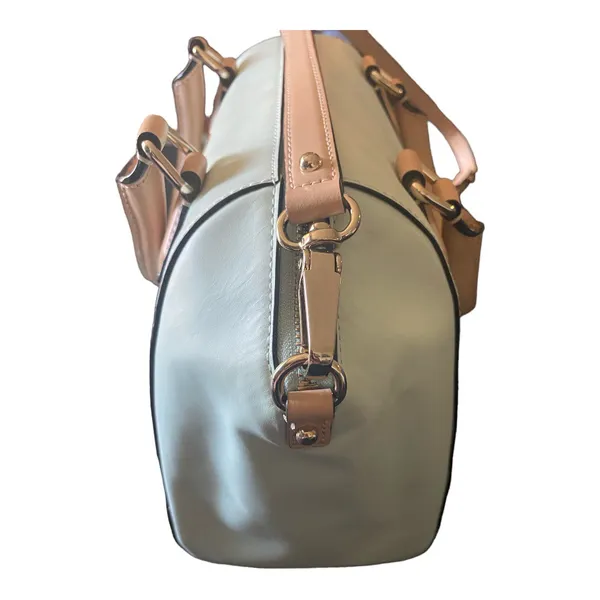 Kate Spade NEW YORK-MINT MOJITO PIPPA PARNELL STREET LEATHER SATCHEL Perfect spring bag, mint green white tan handle and crossbody strap, top zip closure, stripe print interior, inside zip pocket, inside two open pockets, amazing condition, there are two call outs, a small smudge on the bottom of the bag and a small smudge on one corner, please see the last two pictures **This bag is preowned and is being sold as is** - Image 13