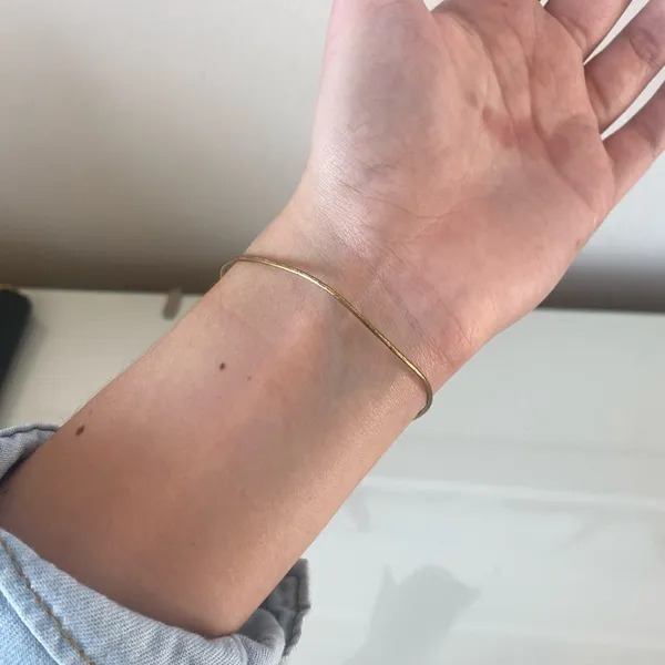 Delicate Gold-Tone Wire Bracelet with Coin Charm - Image 4