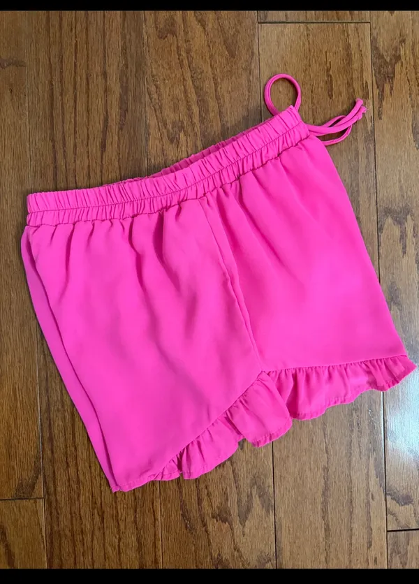 Hot Pink flowy ruffle-hem shorts with elastic drawstring & lightweight - Size M. relaxed design. Gently warn and excellent condition. Measurements approximately 12” waste, not fully stretched out x 12” long. Non-smoking home. priced to sell at as is condition. Don’t like my price, make reasonable offer! And thank you for checking my closet. - Image 2