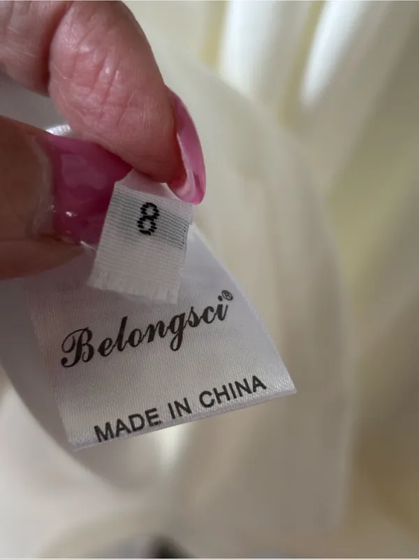 Sleeveless White Mini Dress with Side Cutouts - Image 5