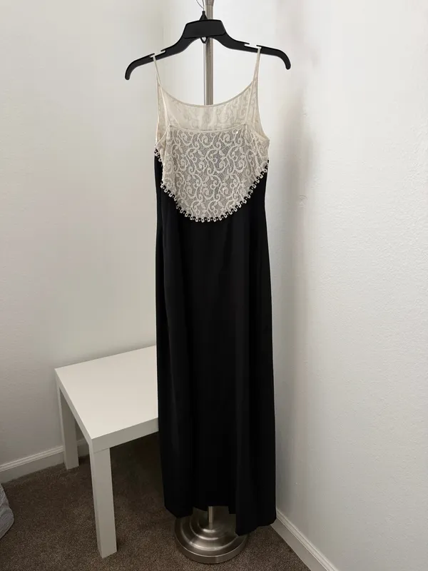 Elegant black maxi dress featuring a delicate cream lace yoke and thin straps. - Image 2