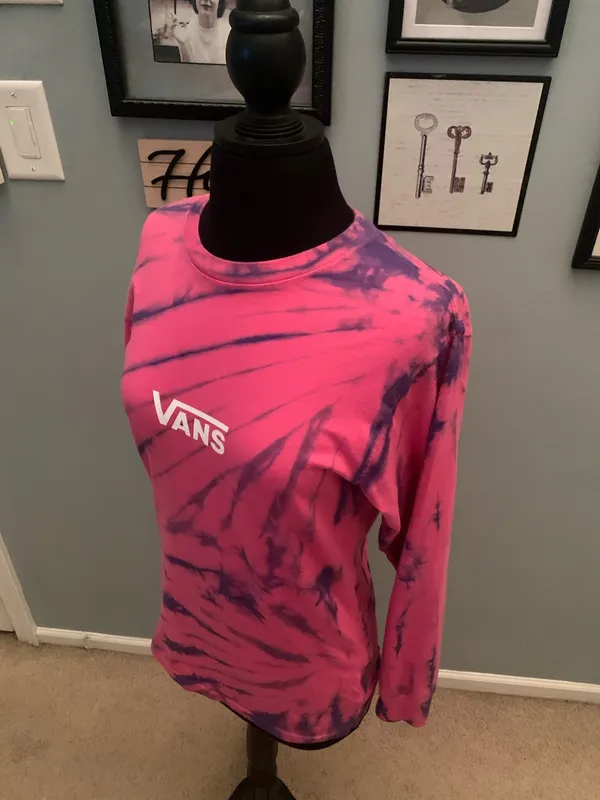 This is a pink and purple Vans tie-dye long-sleeve t-shirt featuring the brand's signature white logo on the chest. - Image 5