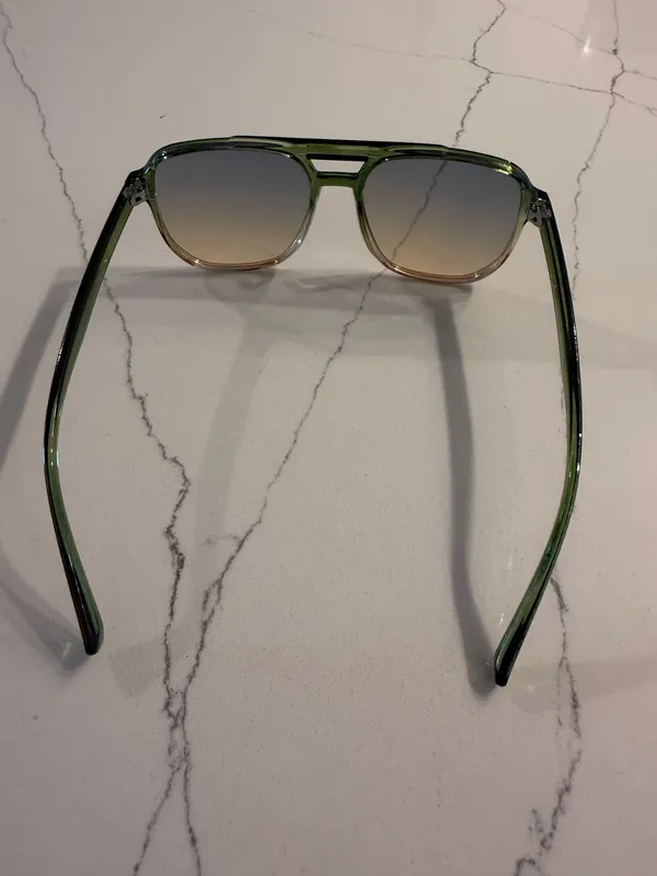 Unbranded Women's Aviator Sunglasses Like New Condition Description: Elevate your accessory collection with these stylish women's aviator-style sunglasses. Featuring translucent green frames and tint-gradient square aviator lenses, these frames offer a chic, modern retro look suitable for any season. Brand: Unbranded Size: One Size Fits Most Condition: Excellent, like-new condition with no scratches, marks, or visible flaws. Includes: Comes with a soft black drawstring protective pouch/case. Carefully packaged and ready to ship promptly! - Image 2