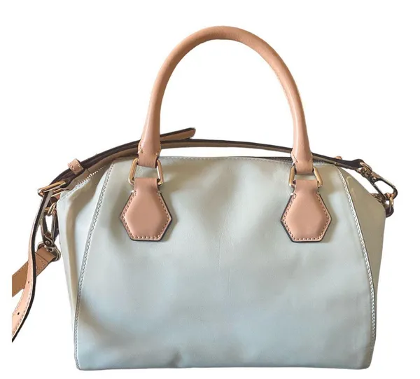 Kate Spade NEW YORK-MINT MOJITO PIPPA PARNELL STREET LEATHER SATCHEL Perfect spring bag, mint green white tan handle and crossbody strap, top zip closure, stripe print interior, inside zip pocket, inside two open pockets, amazing condition, there are two call outs, a small smudge on the bottom of the bag and a small smudge on one corner, please see the last two pictures **This bag is preowned and is being sold as is** - Image 8