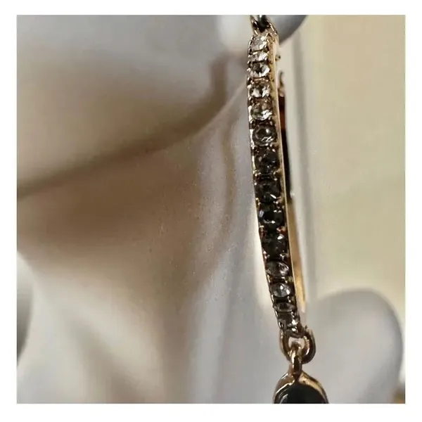 Gold tone hoop earrings with dangling rhinestones - Image 7