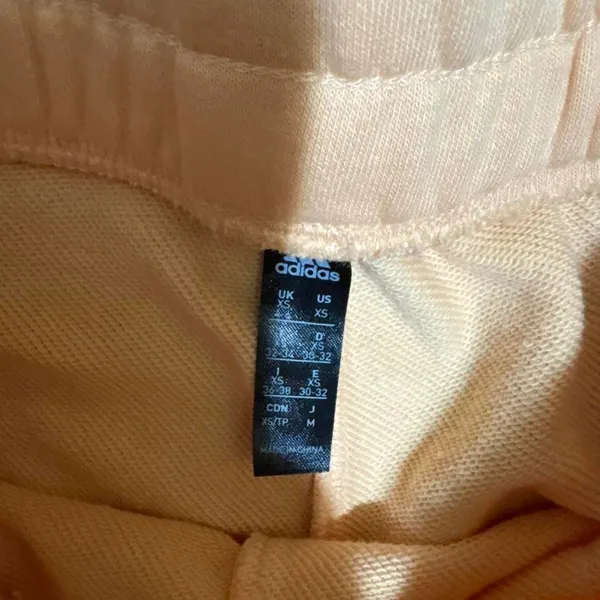 Adidas size xs high‎ waisted peach shorts with white logo - Image 3