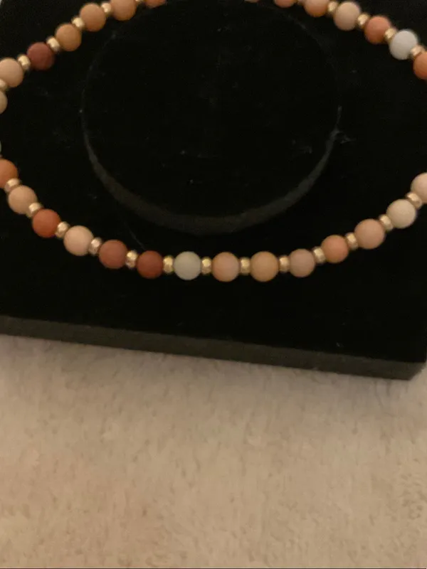 Neutral Multi-Bead Stretch Bracelet with Gold Cross Charm - Image 5