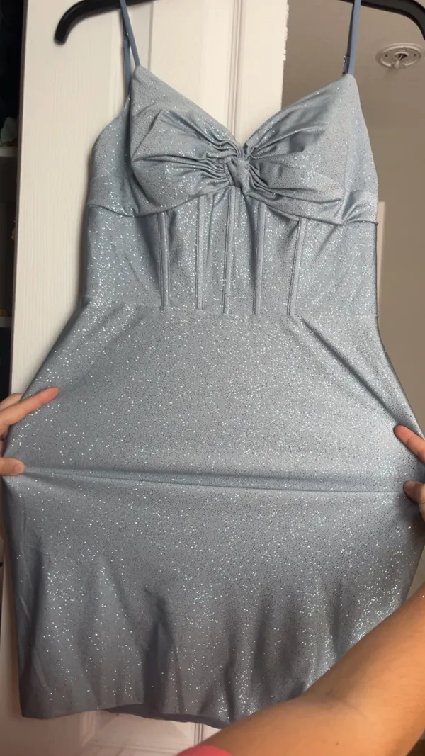 Stacees dusty blue, glittery, mid-length dress, with corset rib design, and knot design on chest, with bra padding built in. - Image 2