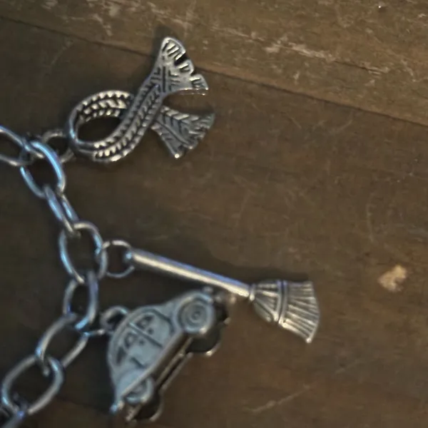 Silver tone charm bracelet with assorted charms - Image 3