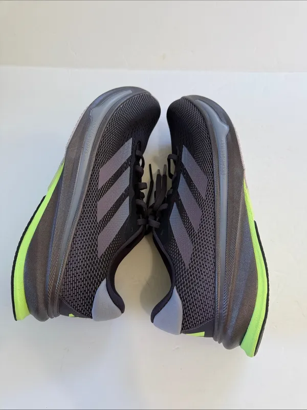 adidas women’s Black Athletic Shoes with White Stripes and Neon Green Accent - Image 7