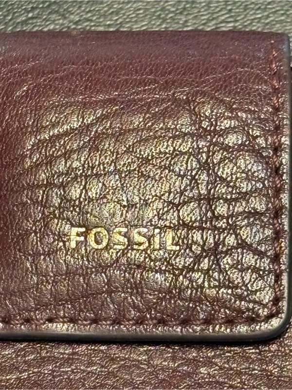 Fossil pebbled leather tab clutch wallet in a deep burgundy or berry color - Image 2