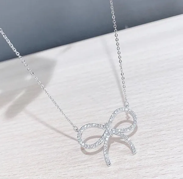 Elegant Silver Bow Necklace - Image 3